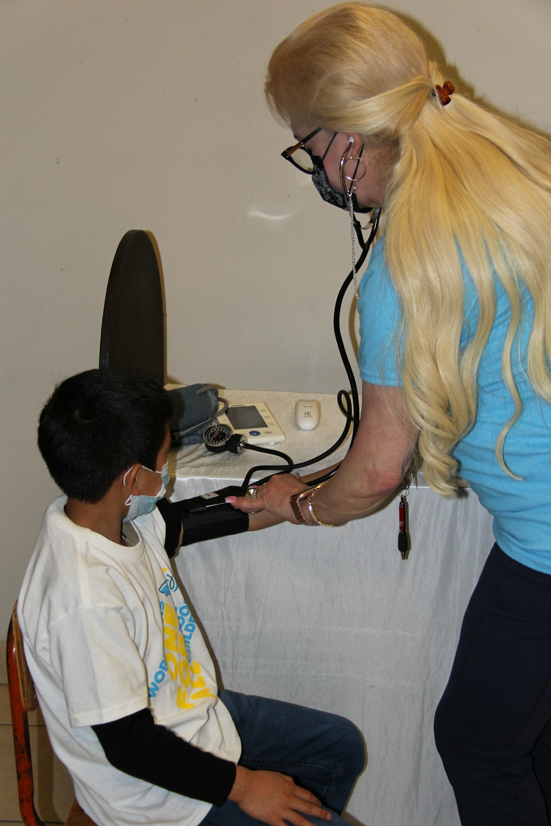 a-woman-is-listening-to-a-boy-with-a-stethoscope-5fpa8ol0df8